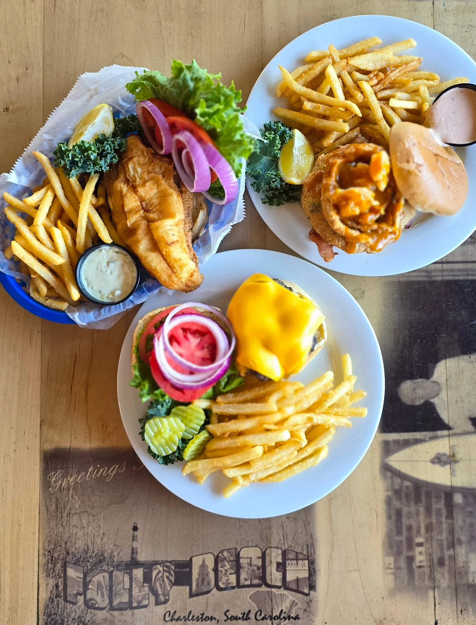Three classic Shack favorites from above — a crispy fried Flounder Crunch Sandwich, the “Double D” BBQ Shrimp & Crab Sandwich, and a Shack's Cheeseburger with fries.