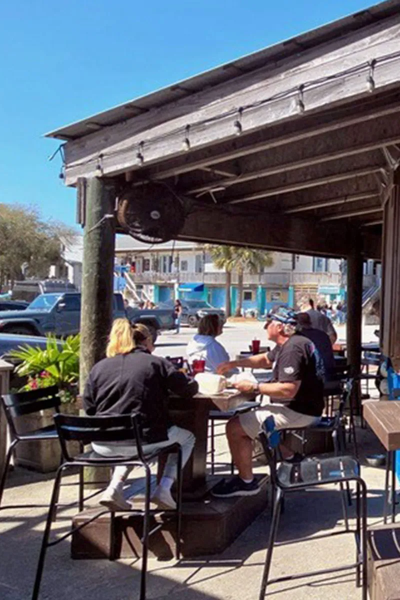 Sunny outdoor seating at The Crab Shacks Folly Beach — casual patio dining steps from the beach at 26 Center Street, Folly Beach SC