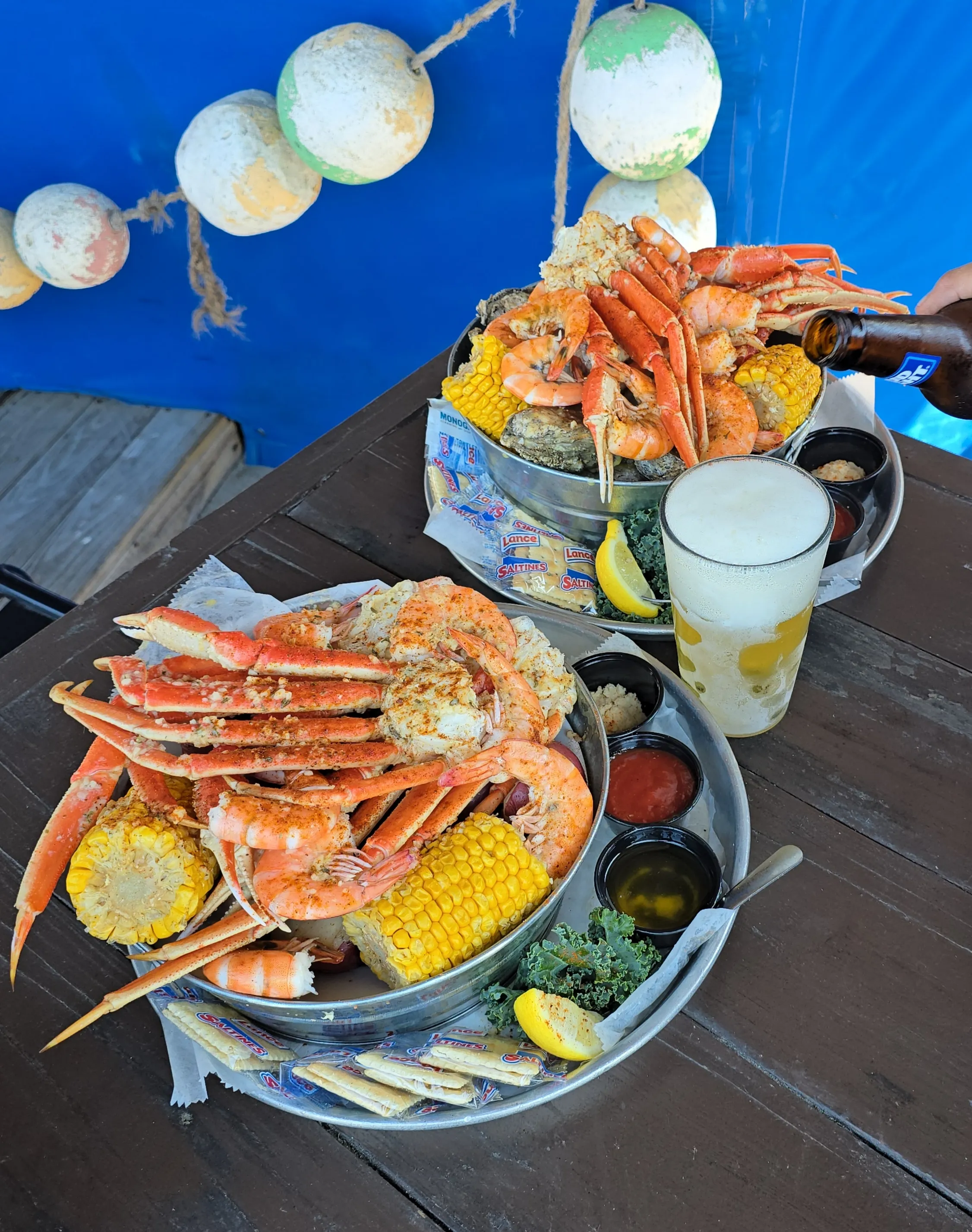 Buckets and beers served at The Crab Shacks — fresh Lowcountry seafood and cold drinks in Charleston
